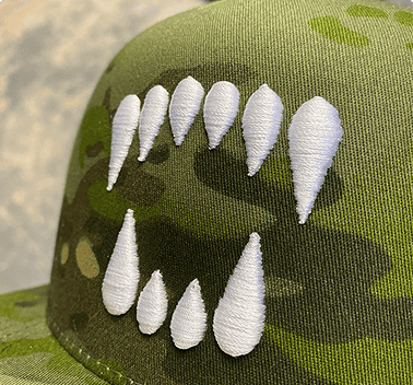 White 3D puff embroidery on a camo hat