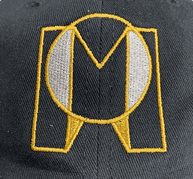 Gold monogram logo embroidered on a black hat