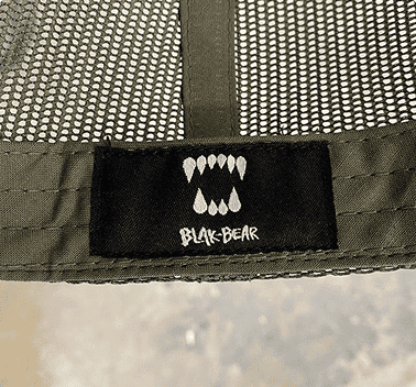 Custom woven label sewn inside a hat