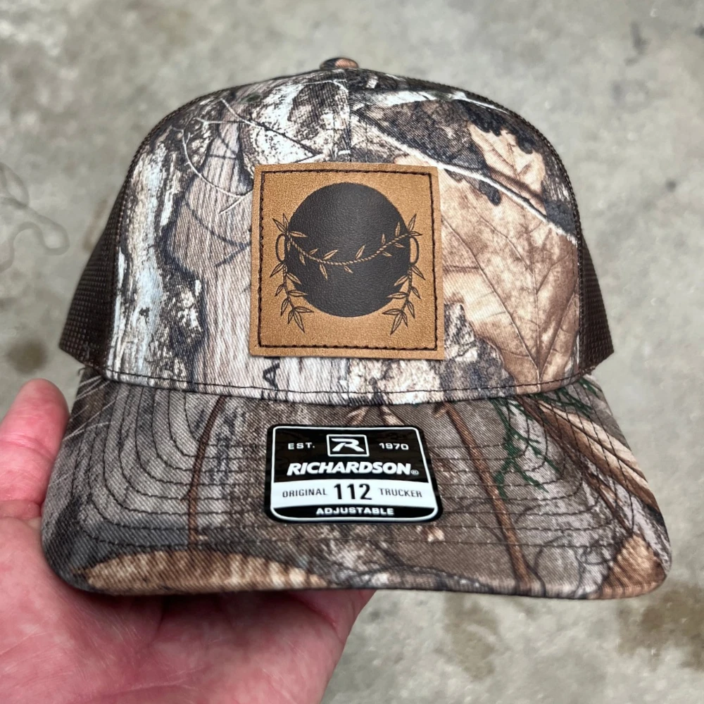 Realtree camo Richardson 112 trucker hat with sewn leather patch