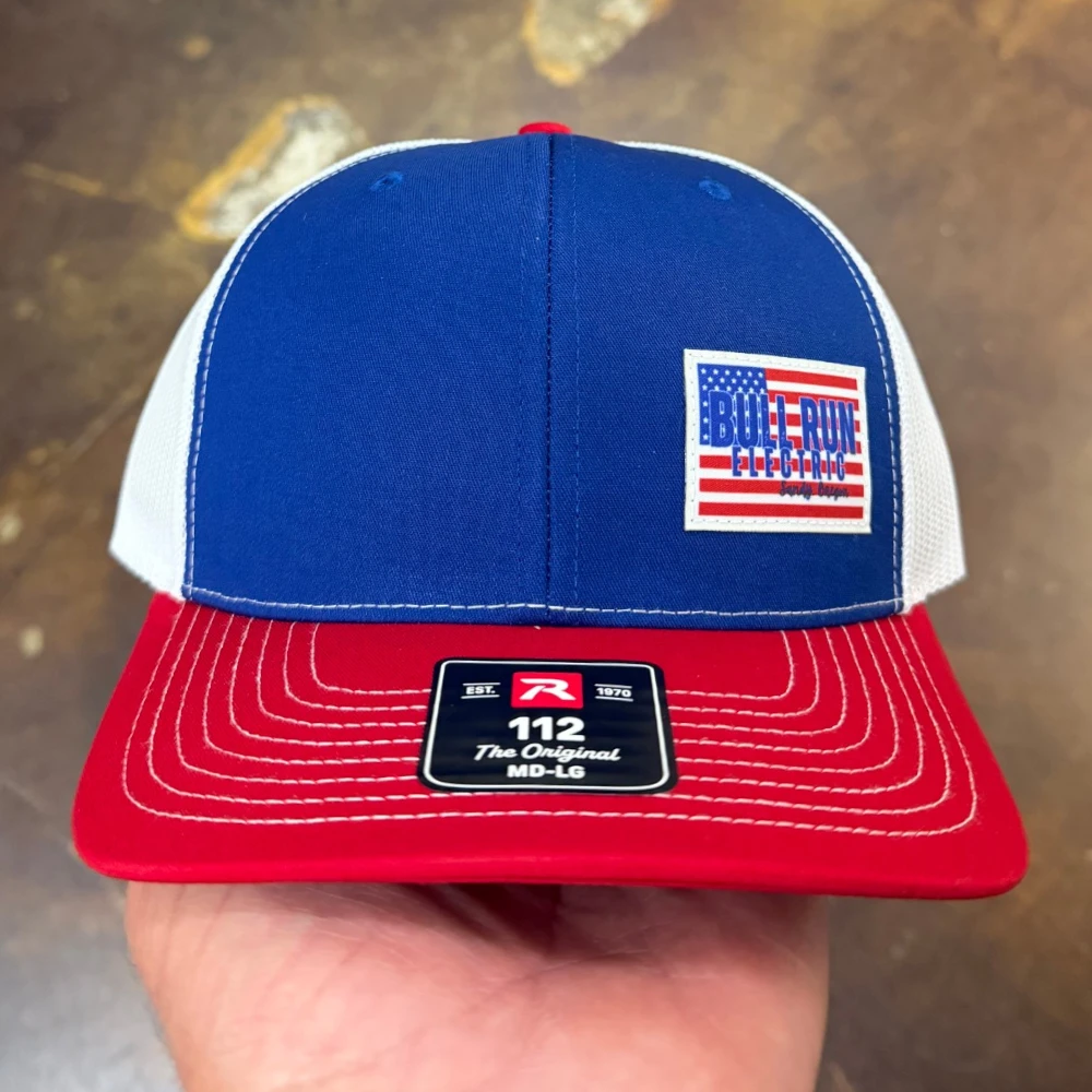 Red white and blue Richardson 112 trucker hat with embroidered American flag patch