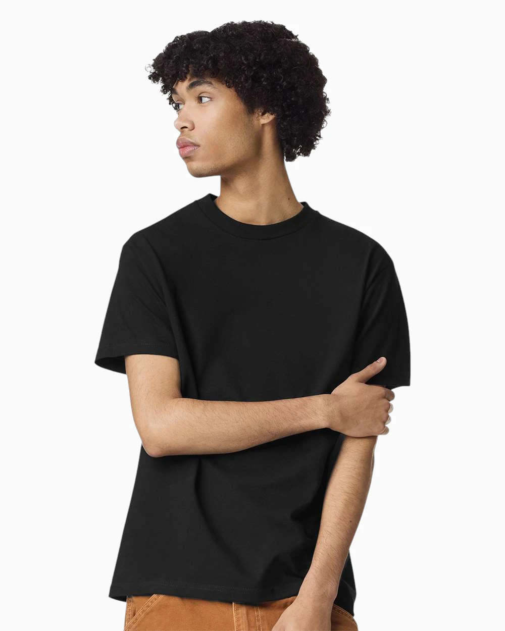 Model wearing a black American Apparel 1301 heavyweight t-shirt