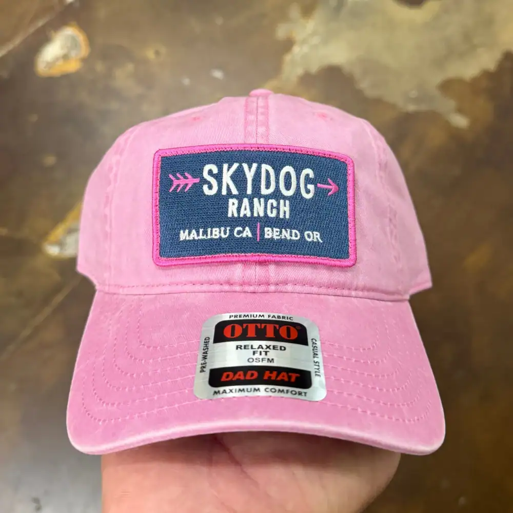 Pigment dyed pink Otto Cap 18-202 dad hat with embroidered patch