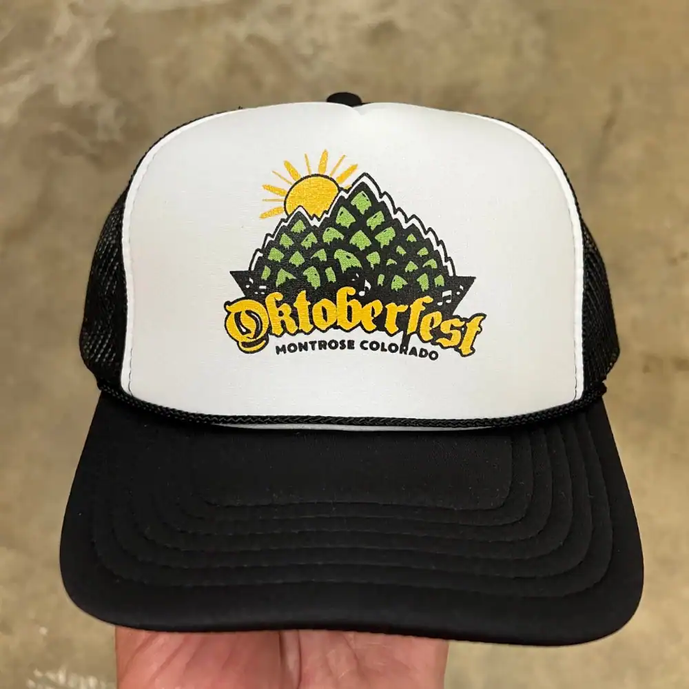 White and black Otto Cap foam front trucker hat with printed festival logo