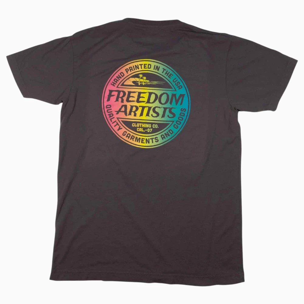 Rainbow gradient screen printed crest on a charcoal t-shirt